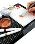 Tim Holtz Travel Glass Cutting Mat - Portable Work Surface with 8X8 Measuring Grid and Palette for Mixed Media - Art Supplies with Carry Case